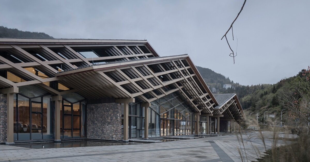 cascading folding roof of GLA design’s community center in china echoes mountain contours