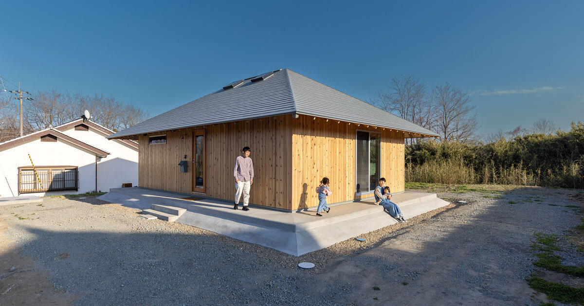 wooden house by architrip extends fluily into surrounding garden in japan