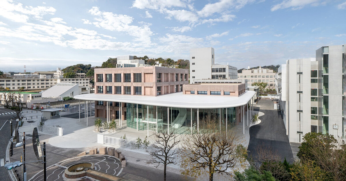 colored concrete buildings emerge from cloud&like floating roof at japanese campus