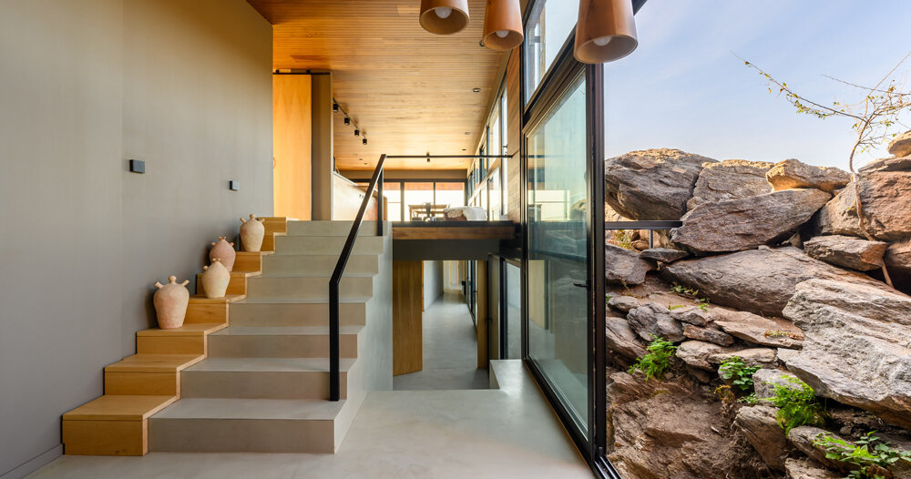 casa en piedras: estudio palacios nests modern home among large stones in argentina