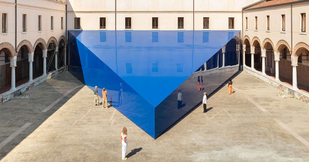 reflective triangular blue pavilion lands in renaissance&era courtyard at venice biennale