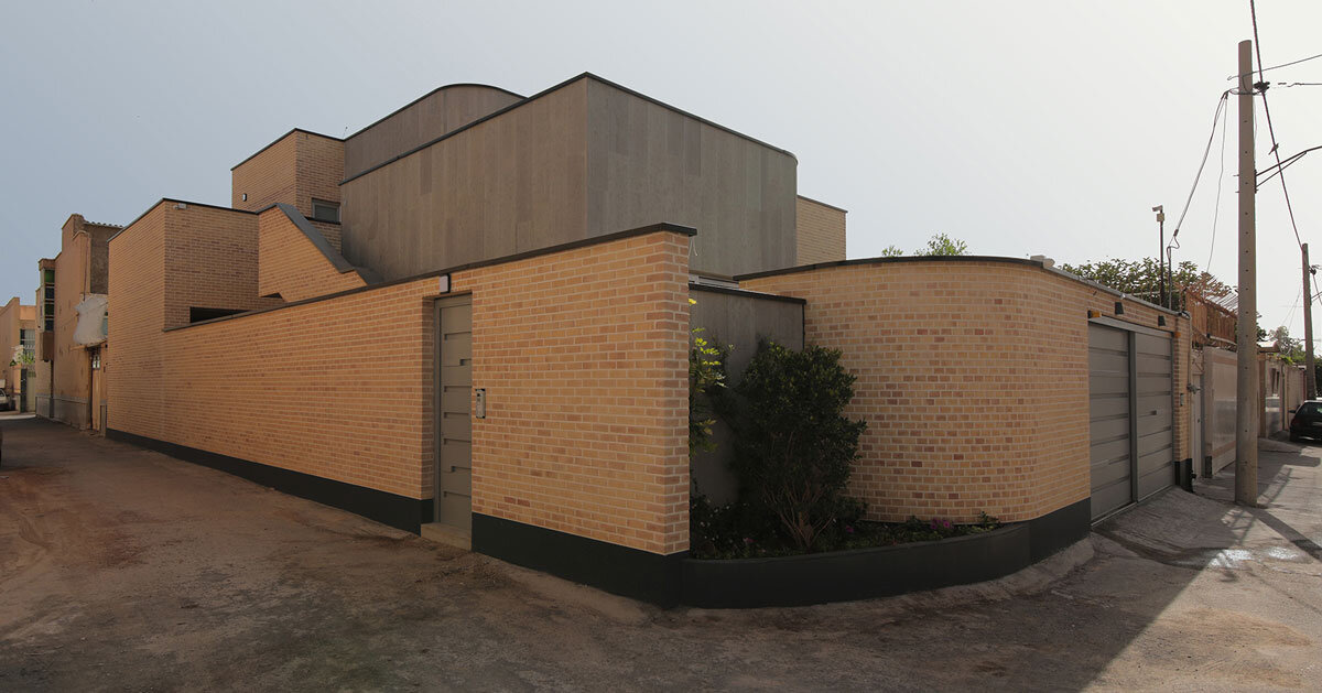 illuminating voids puncture through brick&amp;amp;laid annab house in iran