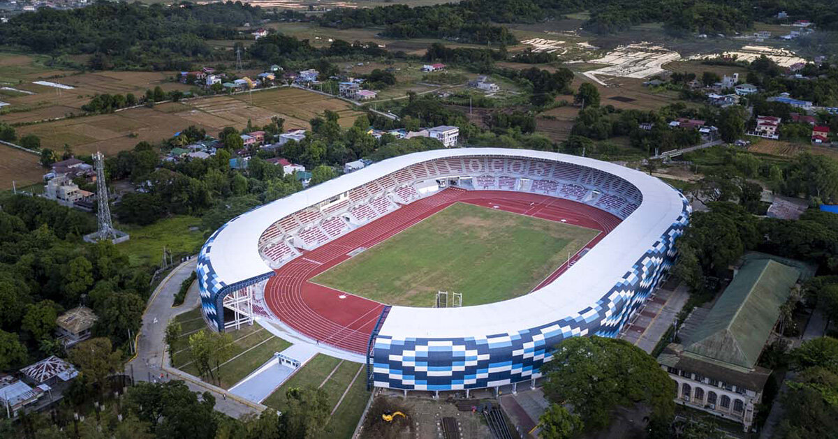 geometric facade wraps stadium by WTA design studio, reflecting traditional ilocano fabric