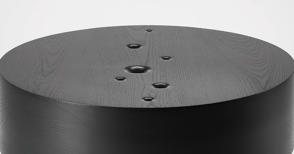 jung hoon lee carves ripples across void table’s blackened wooden surface