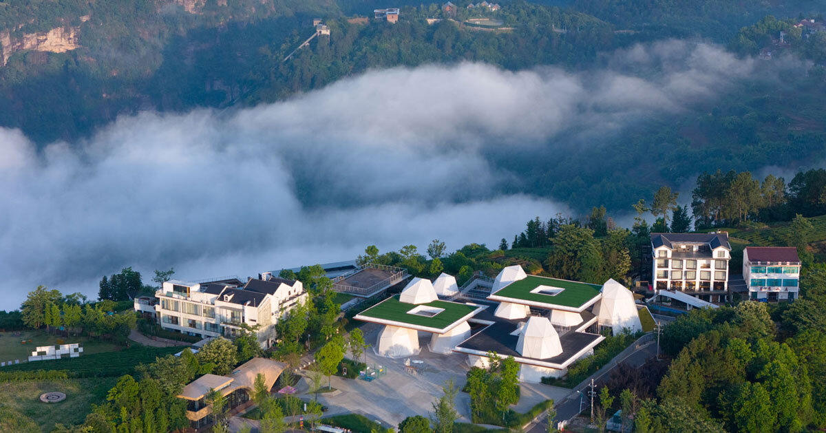 twelve rock&like tents by line+ brace layered steel platforms floating above mountains