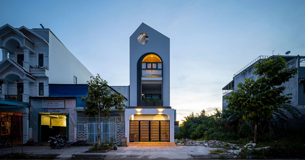 flowing lines and circles on trăng non house’s facade resemble moon rising over mount fuji