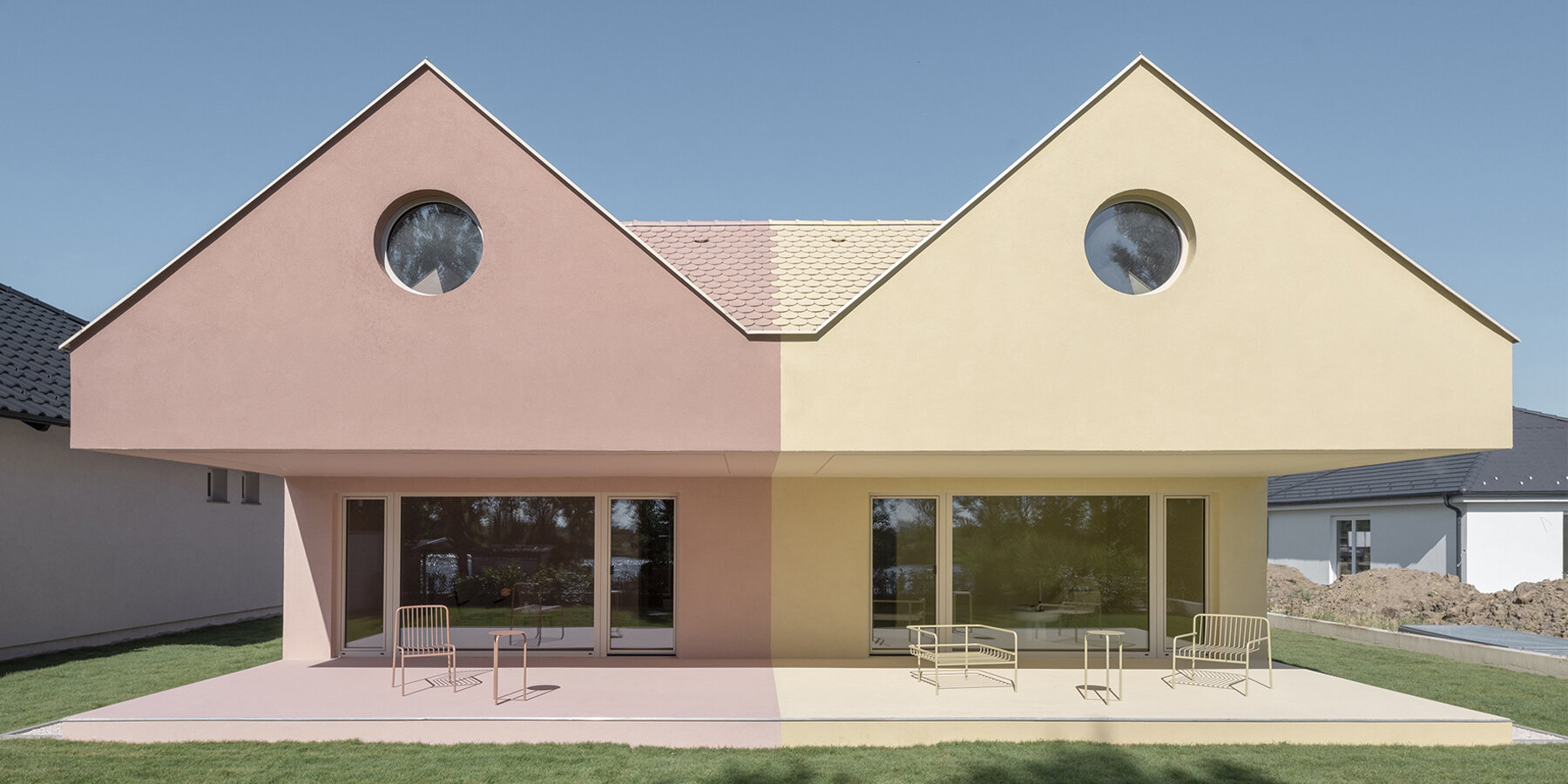 mirrored twin houses by WY design reimagine hungarian village charm