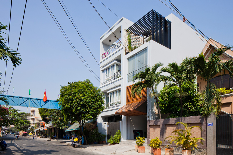 narrow townhouse in vietnam by MM++ features a retractable shutter screen