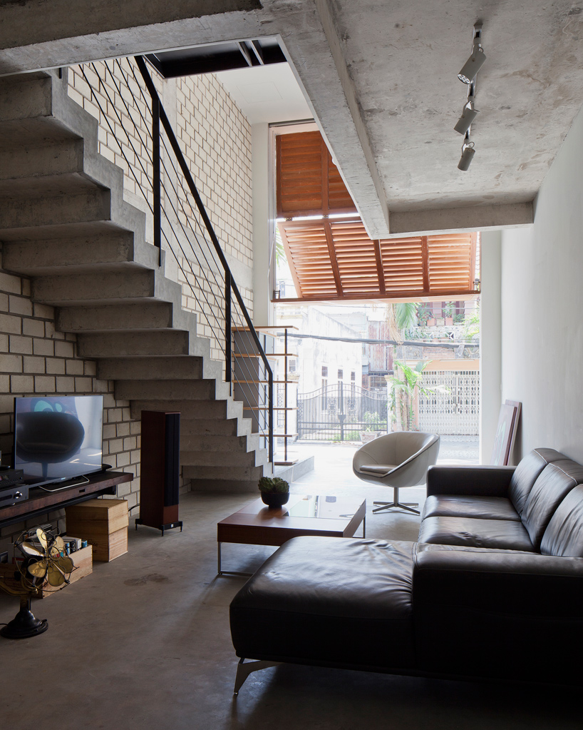 MM++ architects townhouse with a folding-up shutter ho chi minh city vietnam designboom