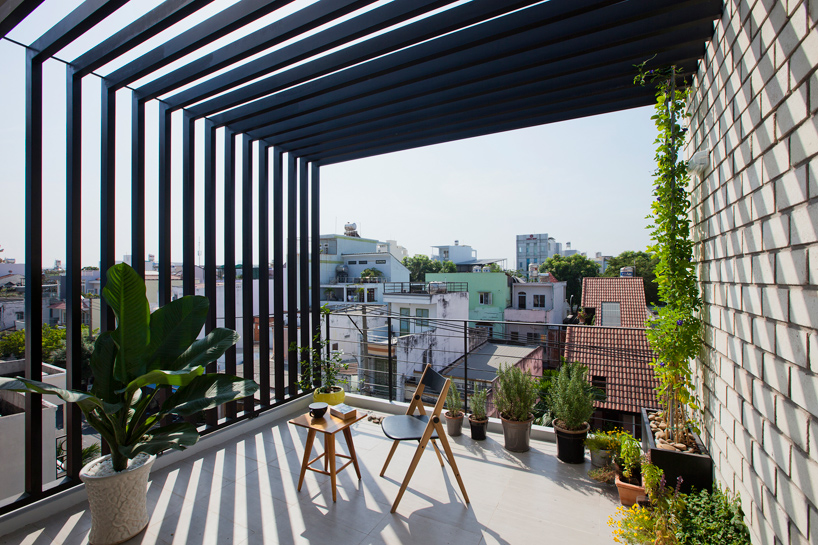 MM++ architects townhouse with a folding-up shutter ho chi minh city vietnam designboom