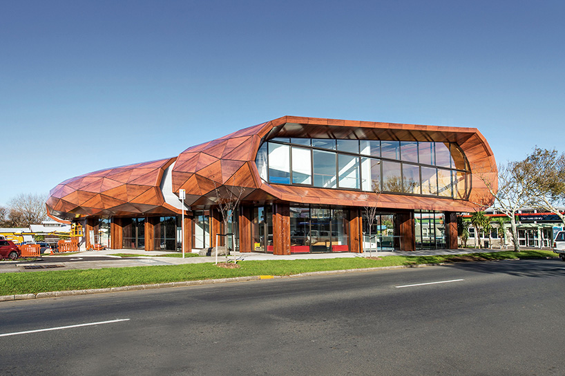 archimedia designs faceted te oro community center in auckland