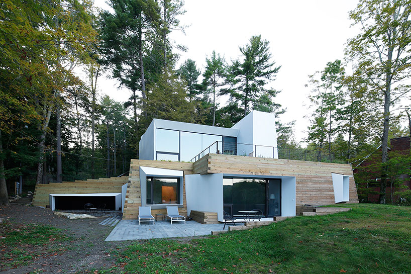 taylor and miller architecture combines two materials to form the lake house