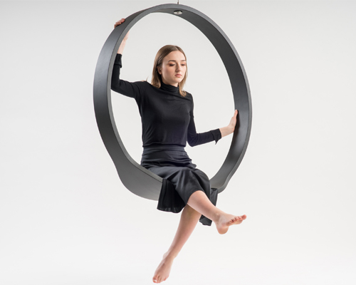 wooden circle swing model n.1 acts as a contemporary rocking chair