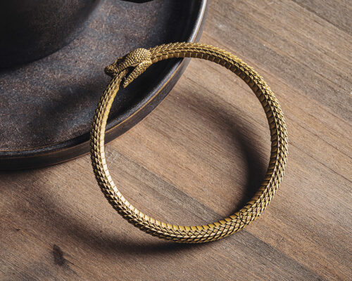 ouroboros bracelet expresses the unity of all things material and spiritual