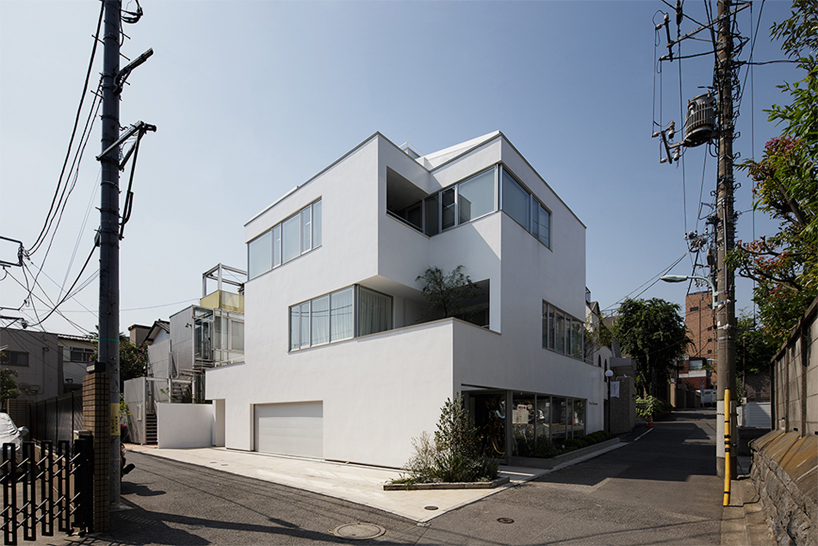 KINO architects stacks mixed-use shiro building in tokyo