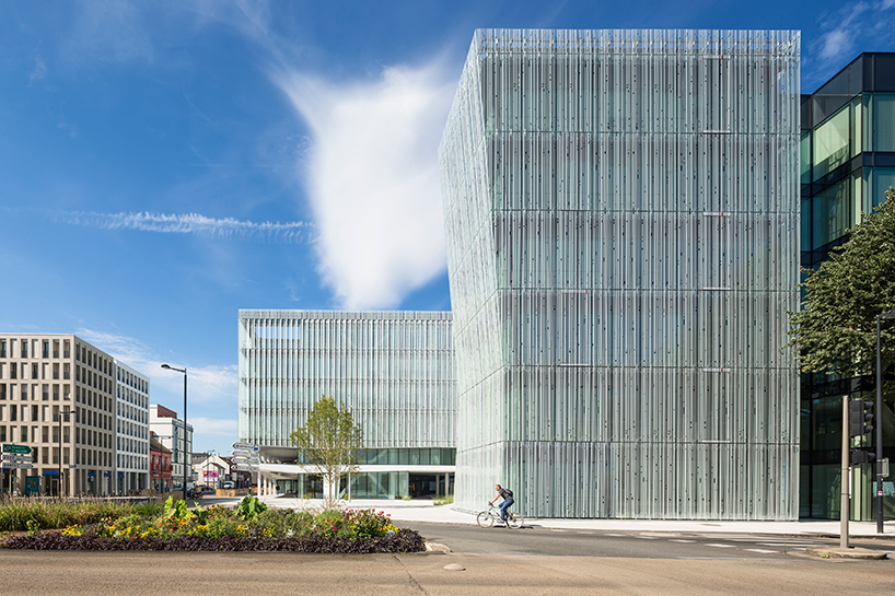 AIA associes clads HQ for french bank in white silk-screened glass façades