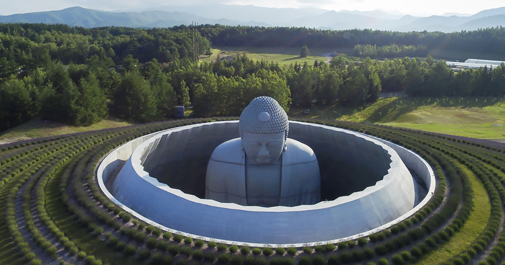 tadao ando surrounds giant statue with 'the hill of the buddha'