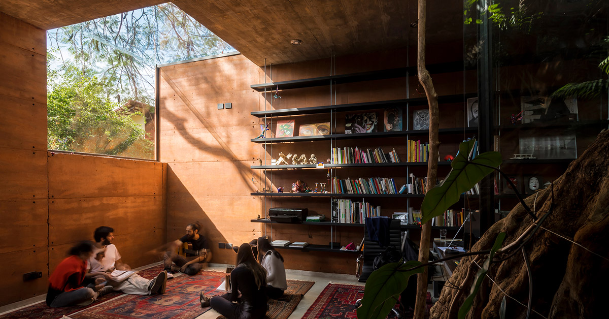 equipo de arquitectura builds an office out of earth around two trees in  paraguay