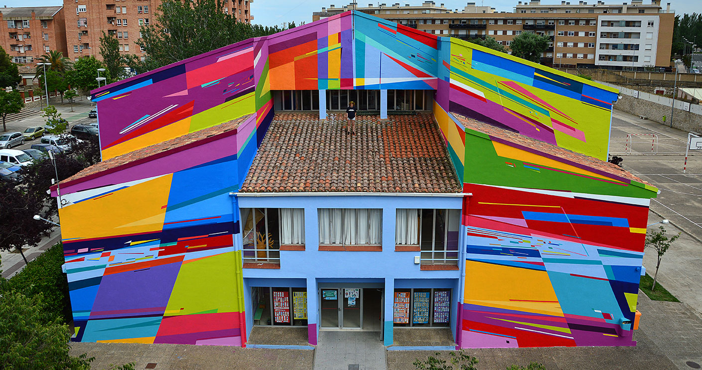 an elementary school façade in spain becomes a radical 
