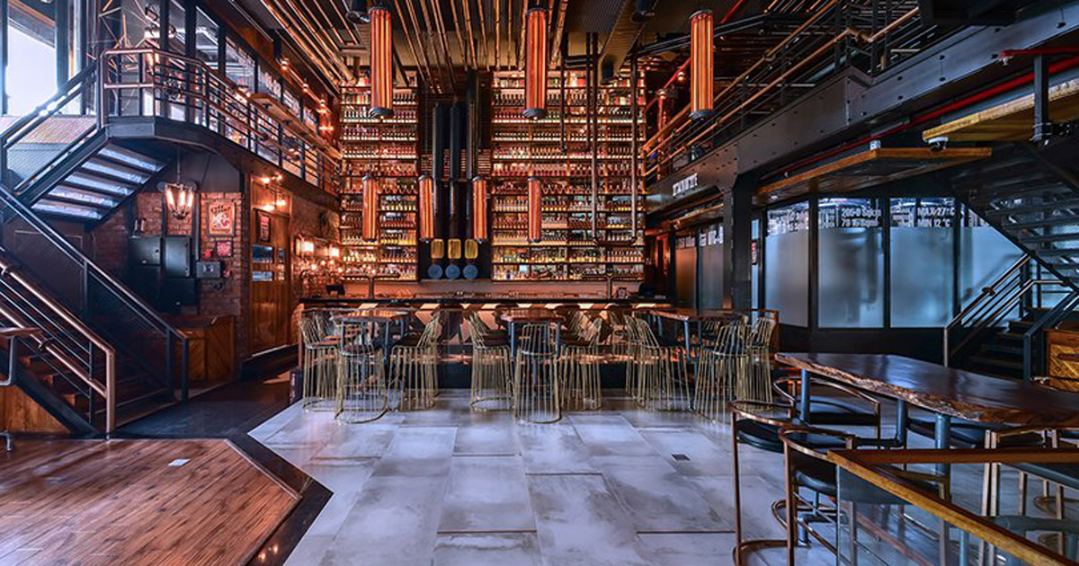 nexus uses copper pipes to adorn the bar interior of 'refinery 091' in ...