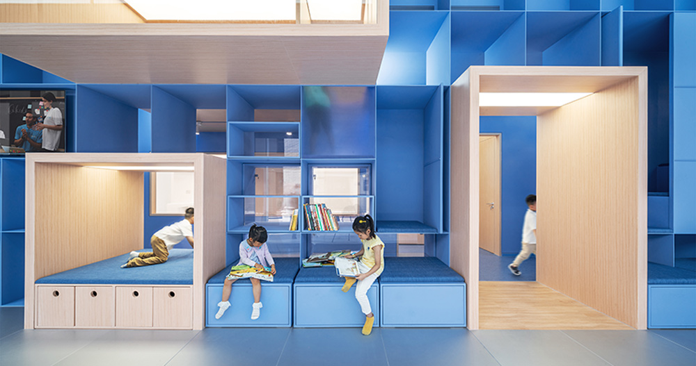 crossboundaries organizes Qkids education space around a 'blue spine'