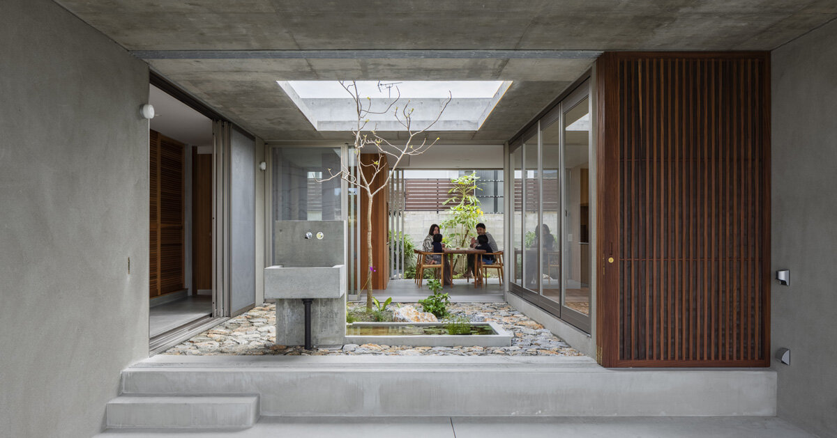 studio cochi architects develops concrete house around central open ...