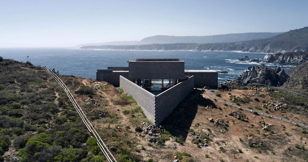 this cinder block 'LBS house' opens broadly over the coastal cliffs of ...