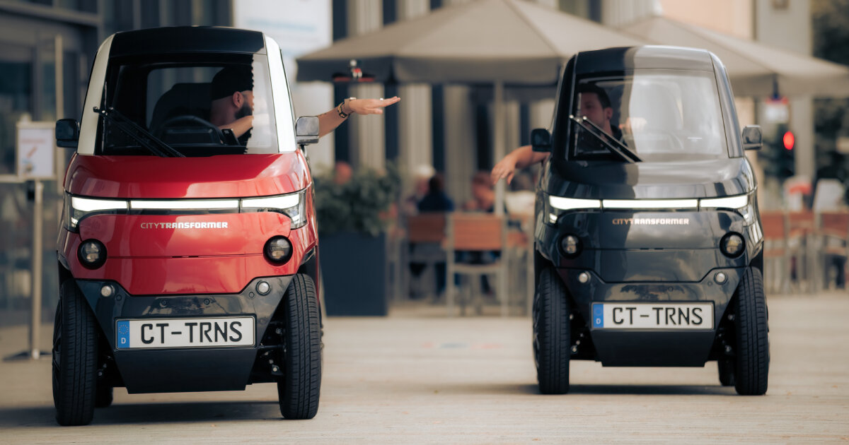 electric microcar retracts wheels to easily park and ride in narrow ...