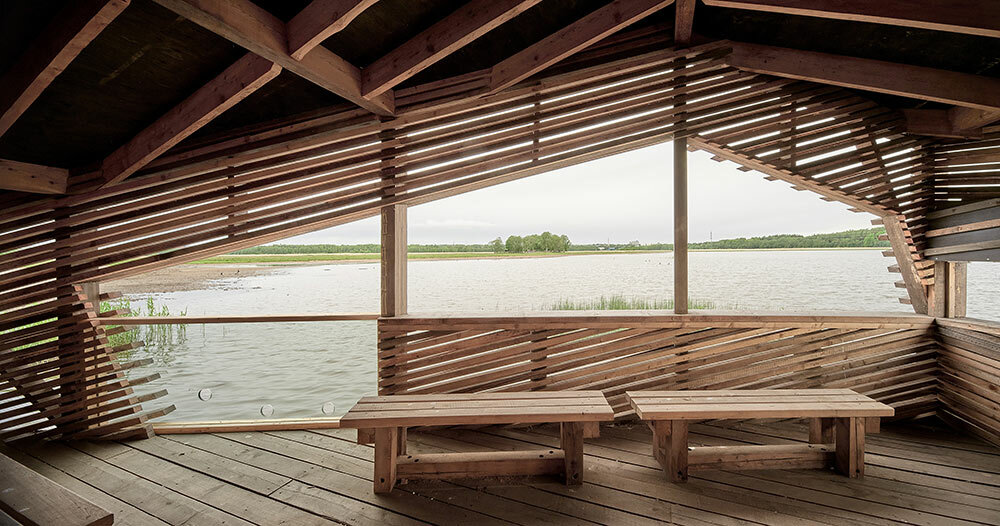 studio puisto designs floating timber for hut birdwatchers finland in