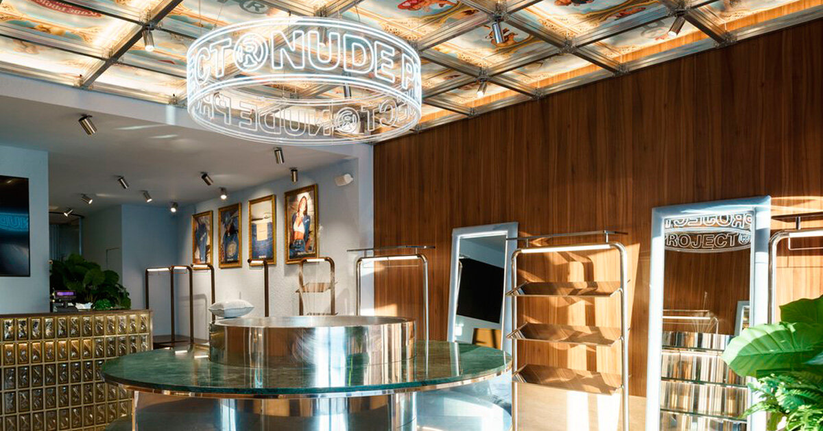 faux coffered ceiling displays famous artworks in milan flagship store by el departamento