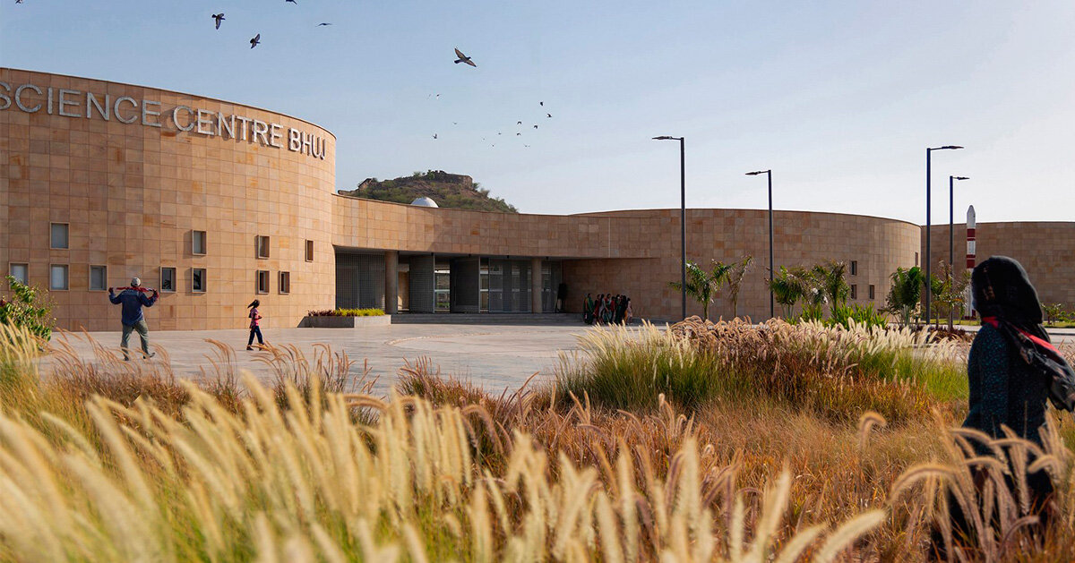 elliptical stone-clad galleries by ini design studio compose science center in india