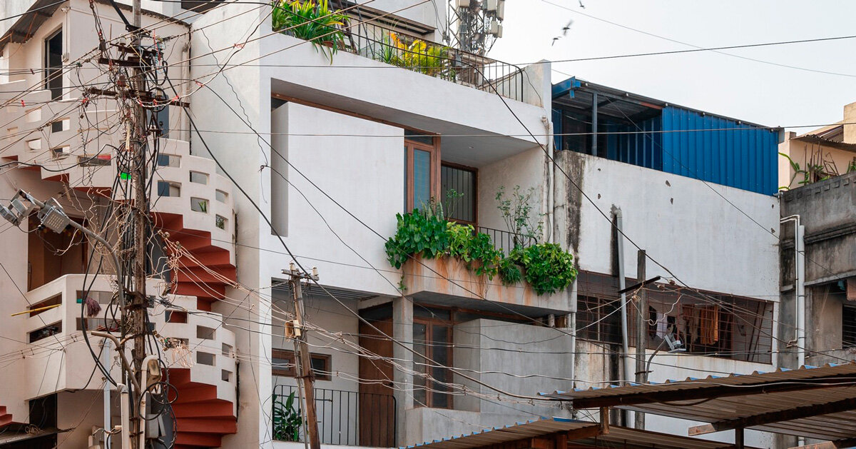 overlapping white volumes compose compact house by rahul pudale design in india