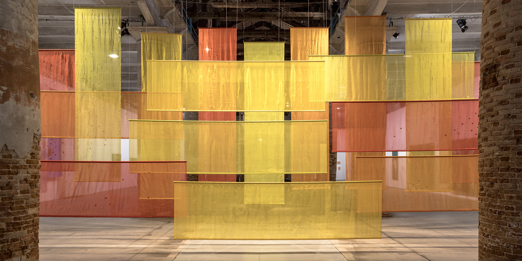 dana awartani visualizes gaza’s devastation at venice art biennale through layers of dyed silk