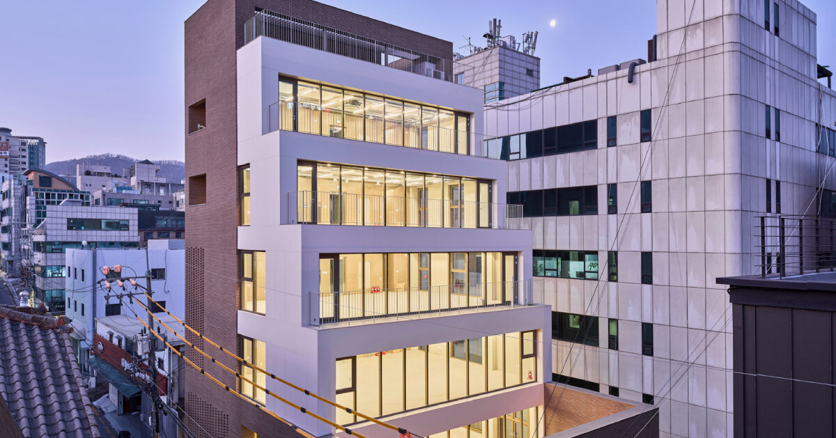 stepped facade extended from brick volume in mixed-use building by mlnp architects in Seoul