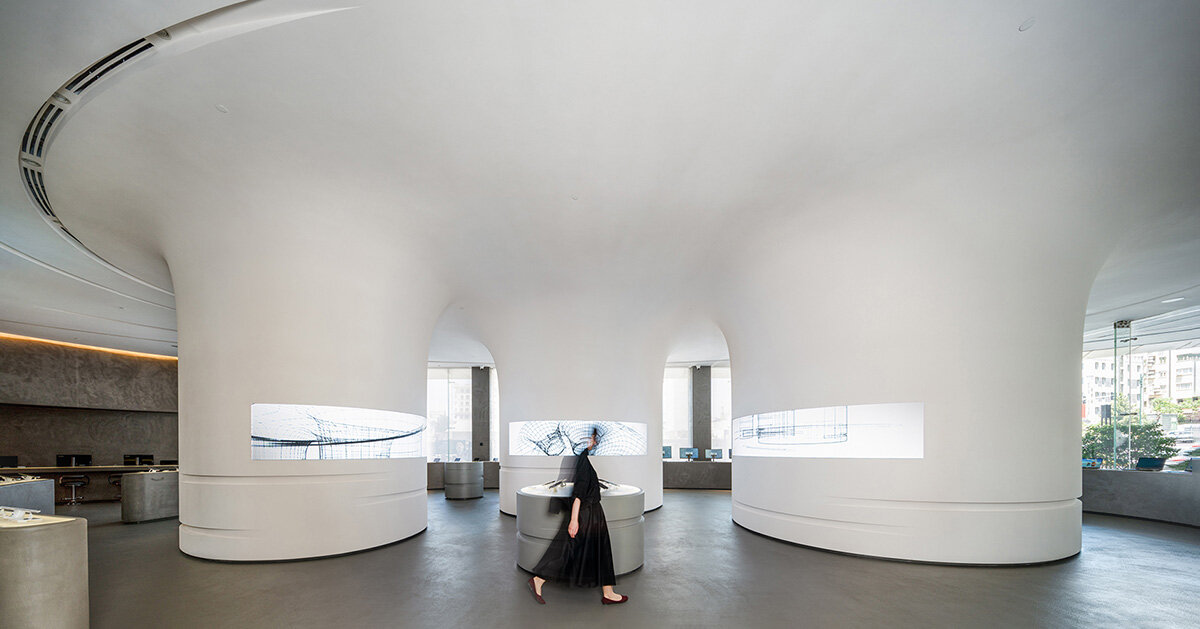 spiral pathways define cylindrical forms in digikala flagship store’s fluid interior