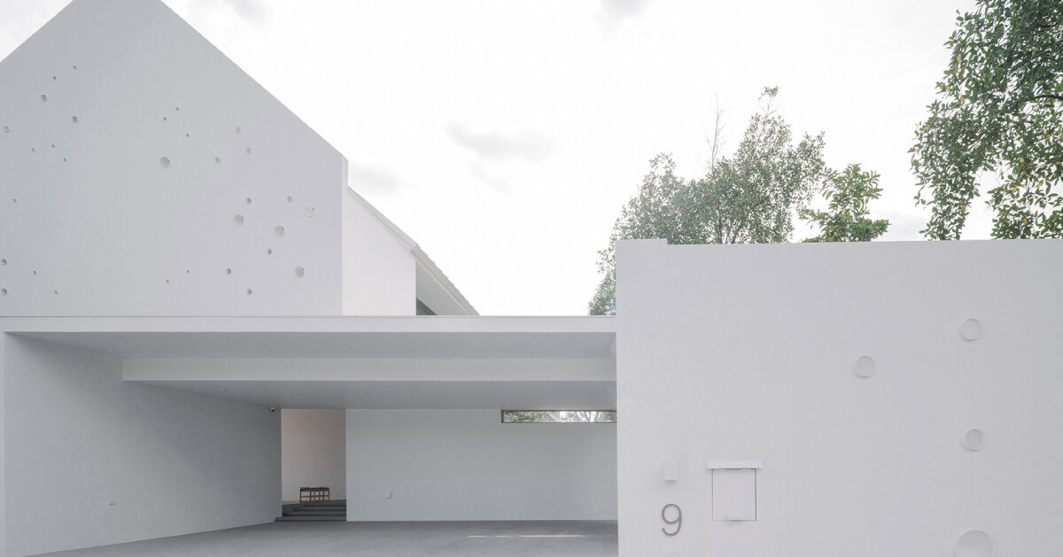 anonym studio’s all-white house in bangkok adopts scandinavian minimalism