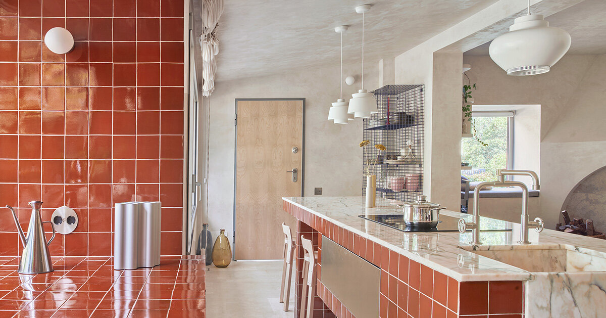 handcrafted burgundy tiles clad window frames of renovated 70s bungalow in madrid