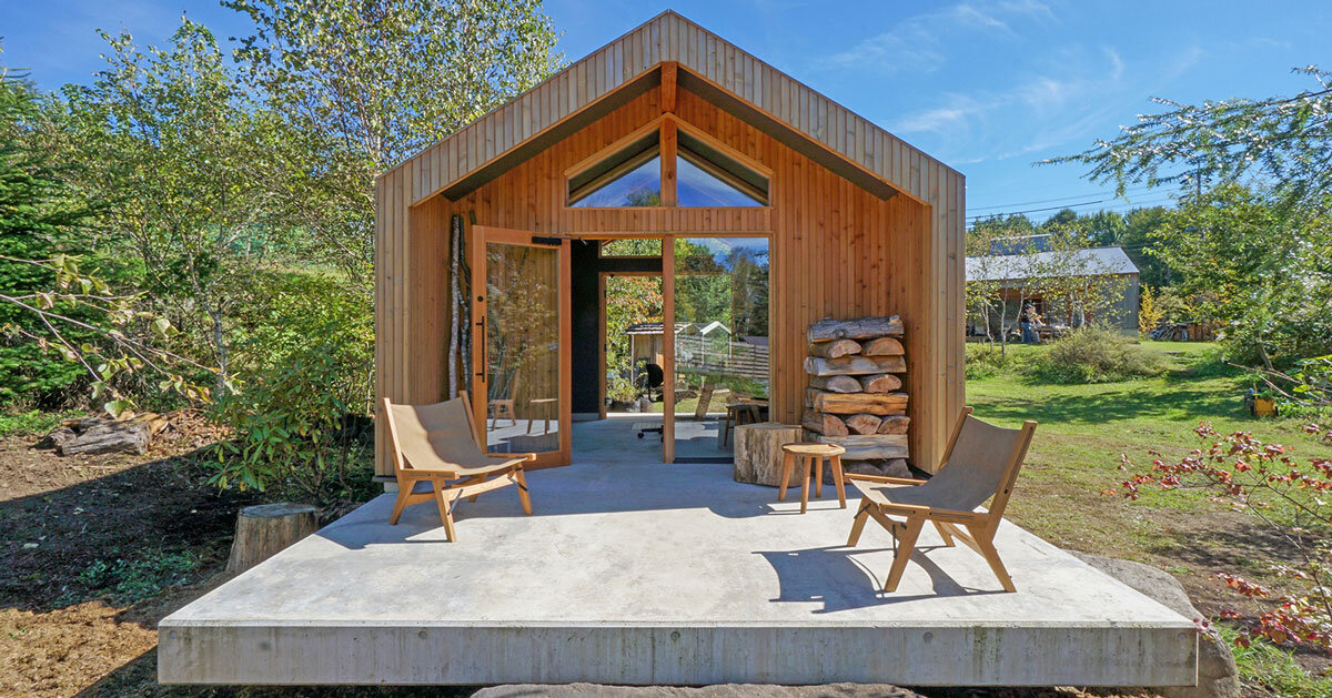 compact hovering cabin by yuji tanabe stands on single-legged foundation in japan