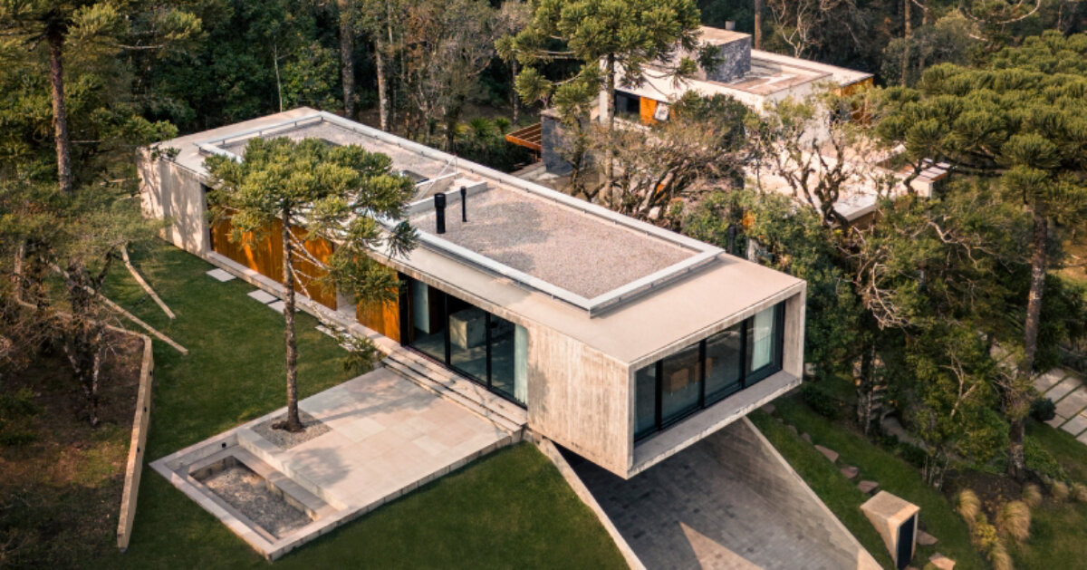 OSPA’s concrete altos house cantilevers at a forested brazilian hilltop