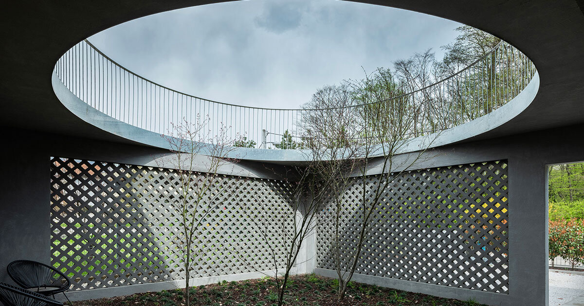 perforated concrete facade encloses courtyard within geometric family house in zagreb