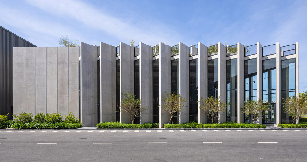 concrete louvres wrap this factory in vietnam, designed by baumschlager eberle architekten