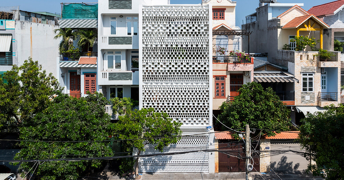 sanuki daisuke architects redefines vietnamese tube house with rhythmic light steel shades