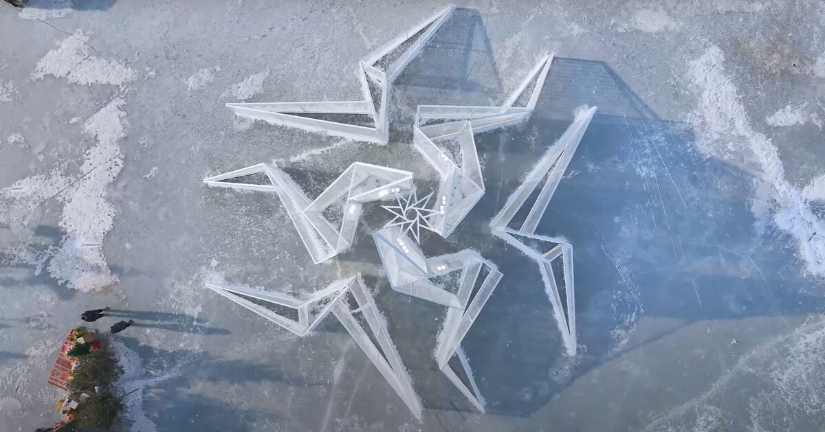 white flame installation’s sharp geometry resembles ice crystals along lake in china