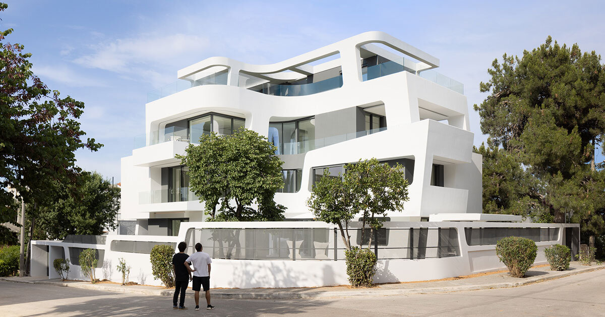 sculptural ribbon-like volumes compose dual residence by direction architects in athens