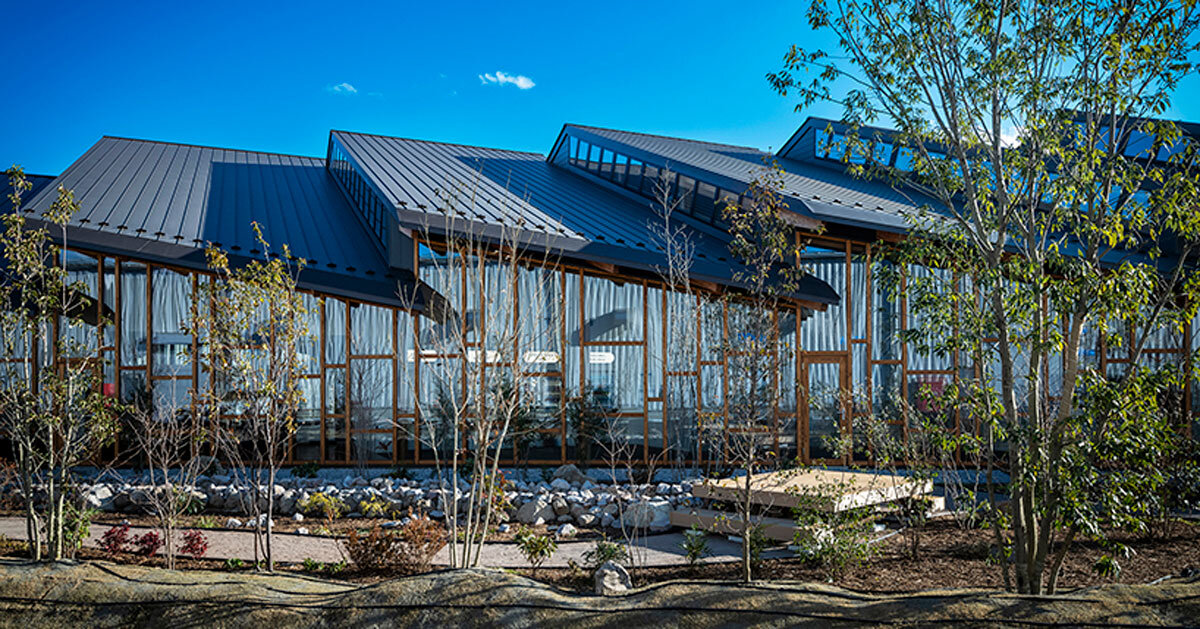 seven overlapping gabled roofs spread over haruna innovation center in japan