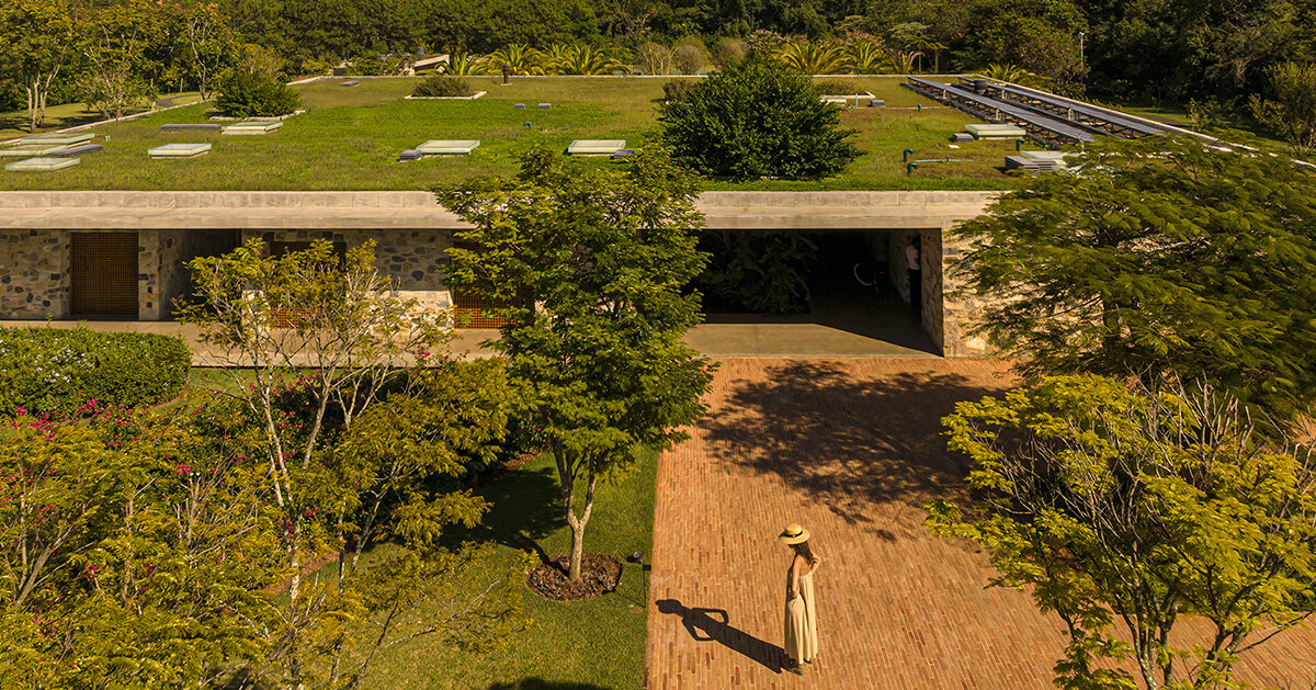 stone volumes compose residence by studio MK27 under continuous overhang in são paulo