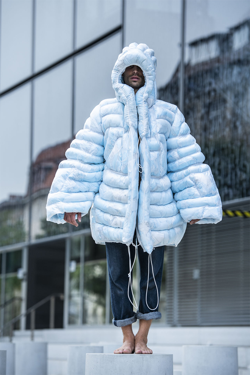This puffer jacket is filled with single-use masks and shows the