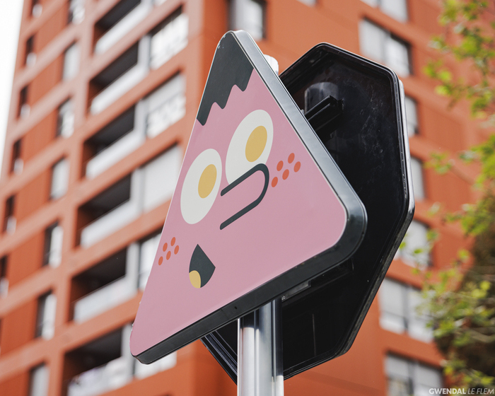 playful characters pop out of wood campers' customized traffic signs in rennes, france