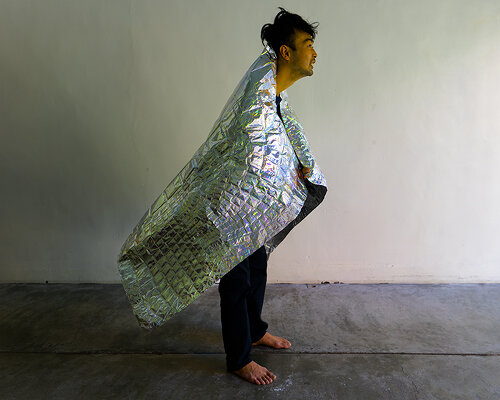 embossed aluminum sheets form reptilian silver cloak by kenta yoshizawa