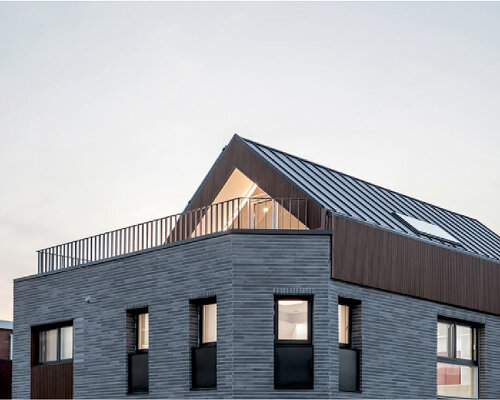 brick tiled residential building stands out in an alley of seoul